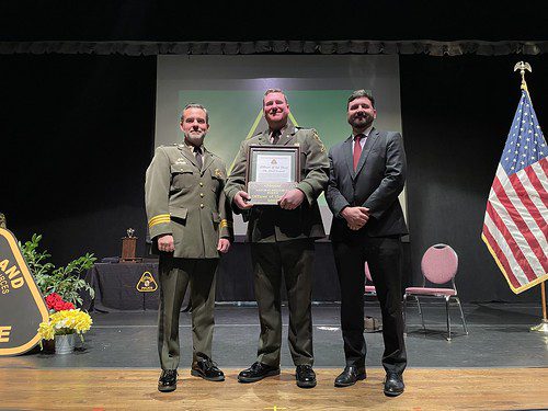 Photo of Officer Albert Leavell (center) being presented the 2023 Natural Resources Police Officer of the Year Award. Also pictured are Acting Lt. Col. Brian Rathgeb (left) and Sec. Josh Kurtz (right). Maryland Department of Natural Resources photo.